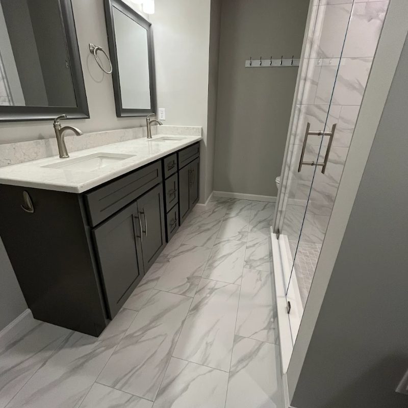 marble bath tile floors, countertops, and custom shower and vanity