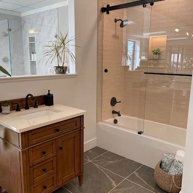 full service bath remodel by Burkholder's Flooring America with custom shower tiles, floor tiles, and vanity